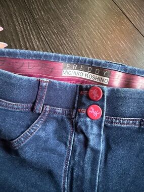 Freddy Dark Blue Jeggings with Pink Accent Buttons and Stitching
